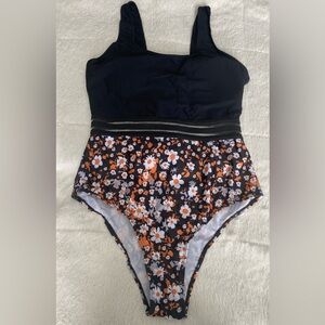 Shein brand, swimsuit for women, one piece, black color with flower design.
